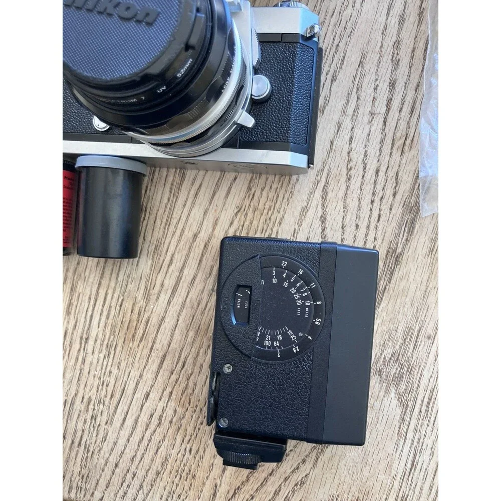 Nikon Nikkormat FTN 35 mm Camera with Additional lens, leather cases, & extras